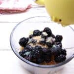 Berries in bowl with lemon squeezer