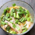Place chicken in bowl, add marinade and top with green onions