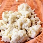 Place cooked and drained cauliflower in thick, clean towel. Squeeze moisture from cauliflower