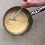 Cook queso over medium high heat