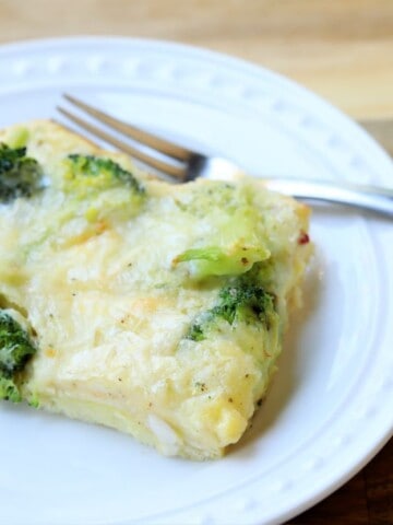 close up of broccoli pepper jack breakfast casserole on plate with fork